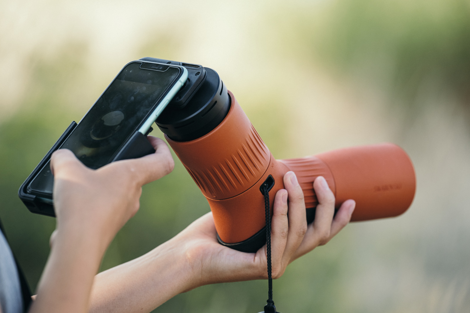 Smartphone attached to a Swarovski spotting scope with the VPA 2 phone adapter